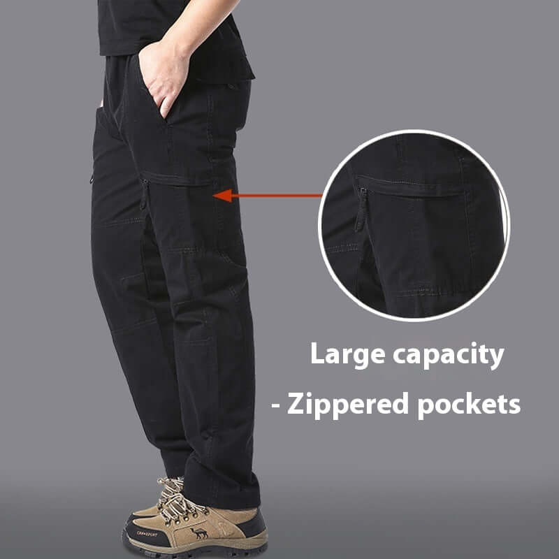 Men's black climbing trousers with zippered pockets, showcasing a large capacity for outdoor activities.