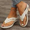 Comfortable white women's sandals with perforated design, perfect for casual summer wear.