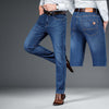 Men's loose straight jeans in light blue denim, featuring a stylish design and comfortable fit for casual wear.