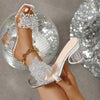 Stylish transparent silver platform high heel sandals with decorative embellishments, perfect for parties and formal occasions.